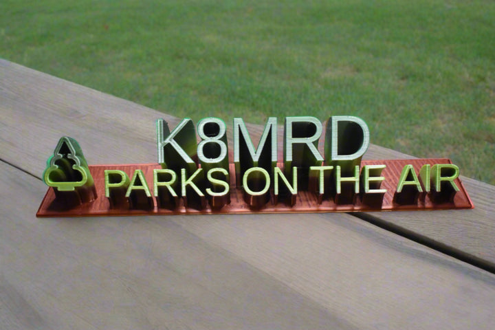 3d printed desk placard with a call sign above the words parks on the air